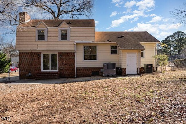 rear view of property with central AC and a patio