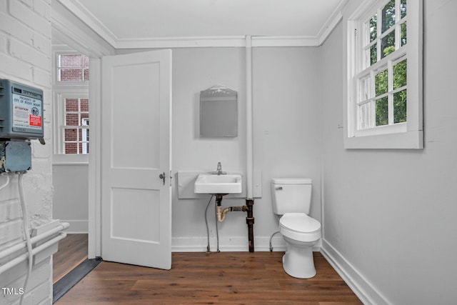 945 Sycamore St, Rocky Mount, NC 27801 - half bathroom with toilet, wood finished floors, crown molding, and baseboards
