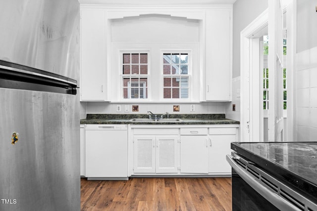 945 Sycamore St, Rocky Mount, NC 27801 - kitchen featuring fridge, white dishwasher, a sink, dark countertops, and plenty of natural light