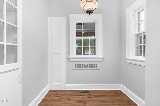 945 Sycamore St, Rocky Mount, NC 27801 - entryway featuring healthy amount of natural light, dark wood-style floors, and baseboards