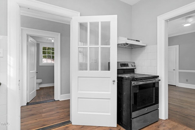 945 Sycamore St, Rocky Mount, NC 27801 - kitchen featuring electric range, under cabinet range hood, wood finished floors, ornamental molding, and tasteful backsplash