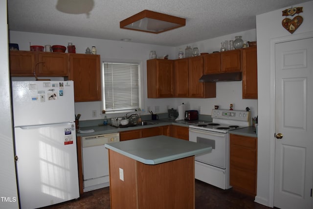 kitchen with range hood, sink, a center island, white appliances, and a textured ceiling