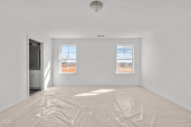 spare room featuring plenty of natural light