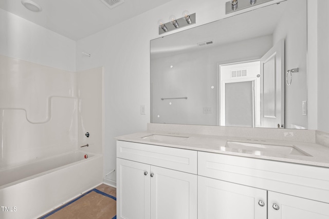 bathroom with vanity and bathtub / shower combination