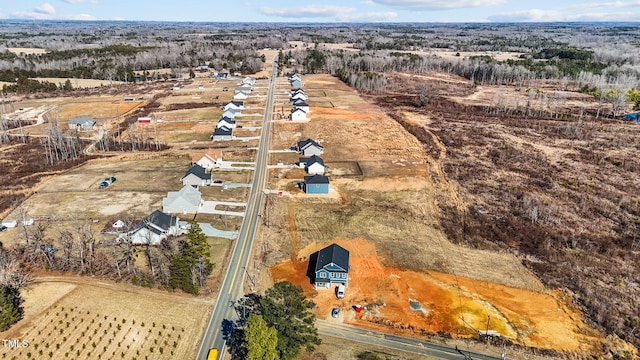 birds eye view of property featuring a rural view