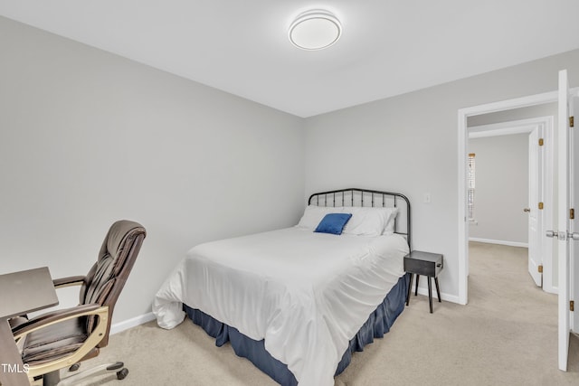 bedroom with light colored carpet