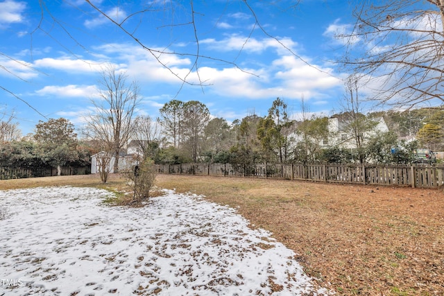 view of yard layered in snow