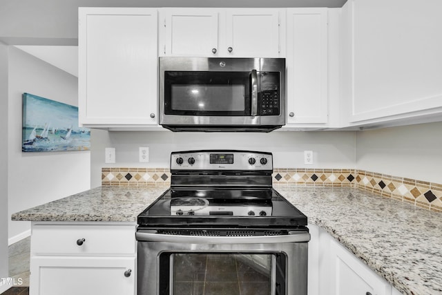 kitchen featuring white cabinetry and stainless steel appliances