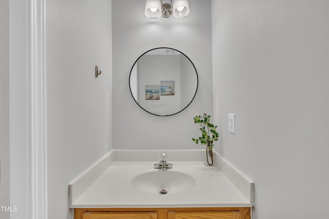 bathroom featuring vanity and a chandelier