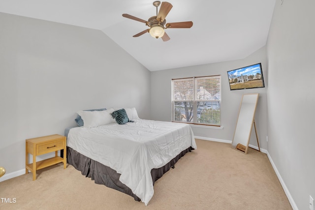 carpeted bedroom featuring ceiling fan and lofted ceiling