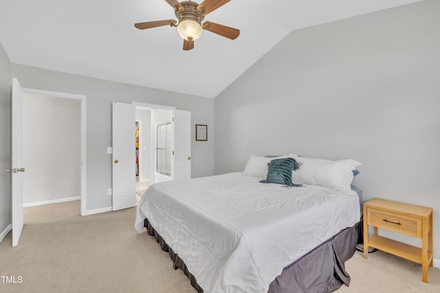 bedroom with vaulted ceiling, light colored carpet, and ceiling fan