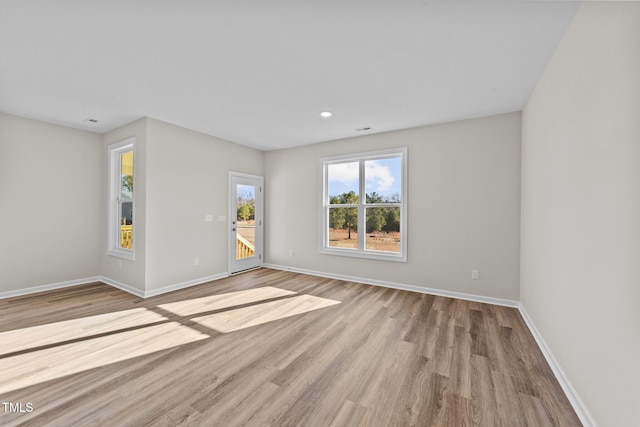 unfurnished room featuring light wood-type flooring