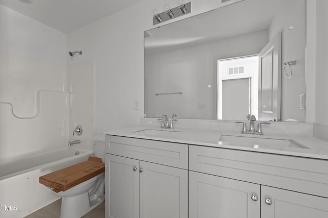 bathroom with vanity and  shower combination