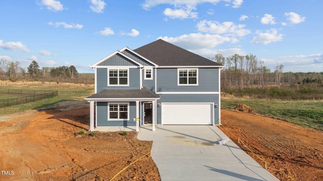 3615 62, Burlington, NC 27217 - view of front of home featuring fence, concrete driveway, an attached garage, covered porch, and roof with shingles
