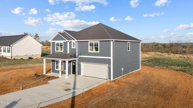 3615 62, Burlington, NC 27217 - view of front facade with an attached garage, driveway, and roof with shingles
