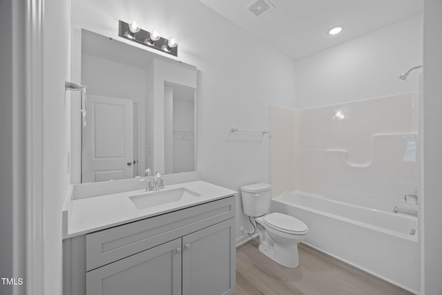 3615 62, Burlington, NC 27217 - bathroom with bathing tub / shower combination, wood finished floors, visible vents, toilet, and vanity