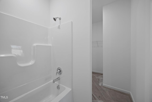 3615 62, Burlington, NC 27217 - bathroom featuring baseboards, a spacious closet, and shower / tub combination