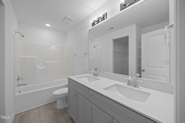 3615 62, Burlington, NC 27217 - full bathroom with wood finished floors, visible vents, and a sink