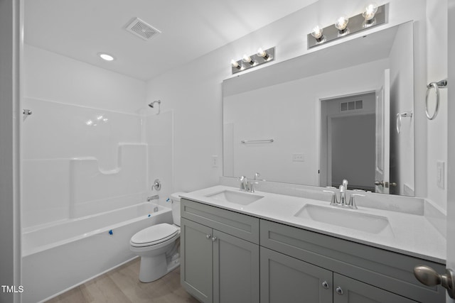 3615 62, Burlington, NC 27217 - full bathroom featuring wood finished floors, a sink, and visible vents
