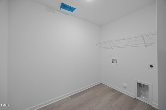 3615 62, Burlington, NC 27217 - washroom featuring laundry area, wood finished floors, hookup for a washing machine, baseboards, and electric dryer hookup