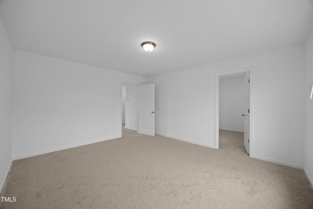 3615 62, Burlington, NC 27217 - unfurnished bedroom featuring a walk in closet, carpet, and baseboards