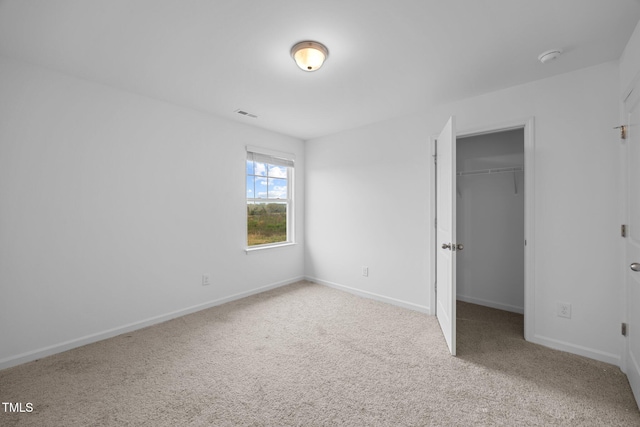 3615 62, Burlington, NC 27217 - unfurnished bedroom featuring a spacious closet, baseboards, visible vents, and carpet