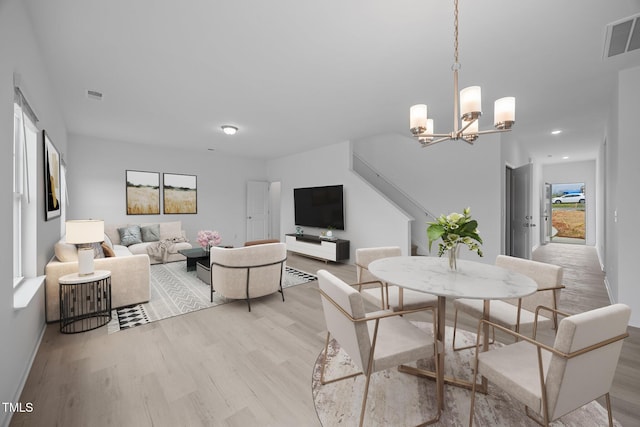 3615 62, Burlington, NC 27217 - interior space featuring light wood finished floors, visible vents, and a chandelier