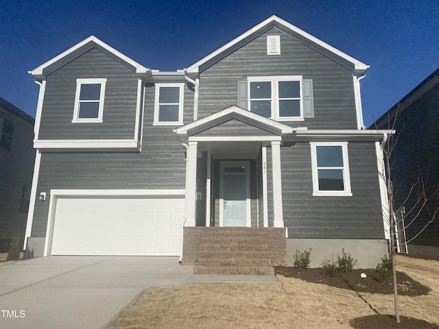 view of front of property with a garage