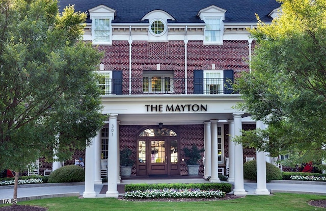 exterior space featuring a porch and a balcony