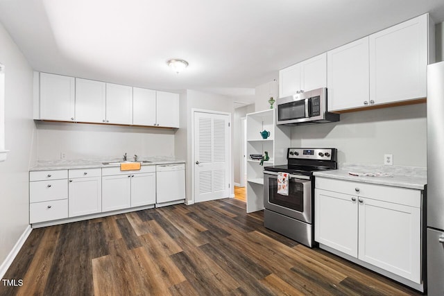 kitchen with white cabinetry, appliances with stainless steel finishes, and dark hardwood / wood-style floors