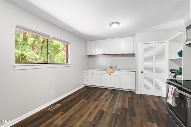 kitchen with dark hardwood / wood-style floors, white cabinetry, sink, stainless steel range with electric stovetop, and white dishwasher