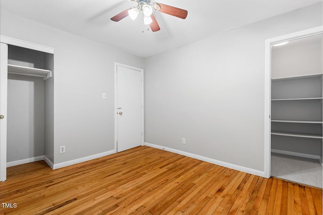 unfurnished bedroom featuring ceiling fan and light hardwood / wood-style flooring