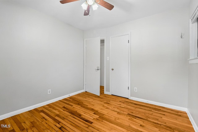 unfurnished room featuring ceiling fan and light wood-type flooring