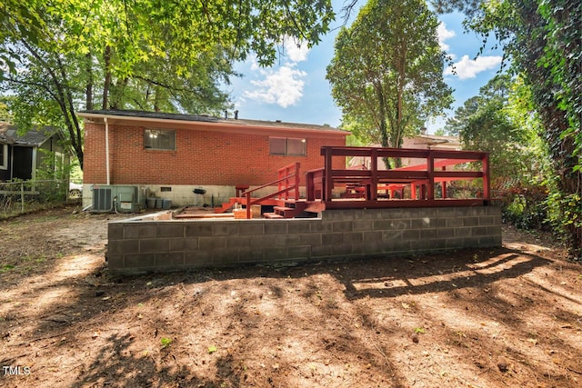 back of house featuring cooling unit