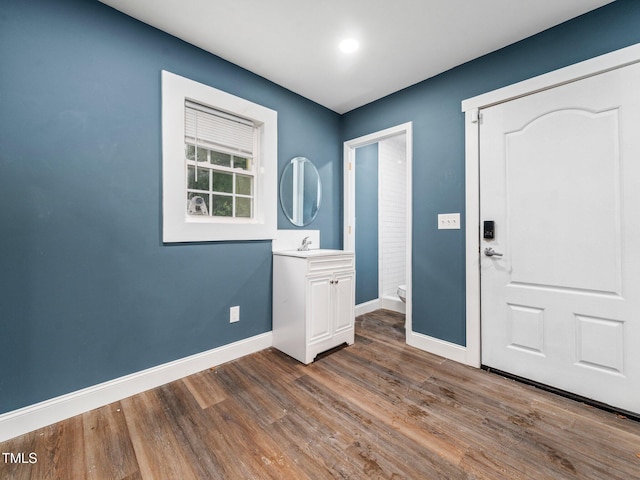 entrance foyer with sink and dark hardwood / wood-style floors