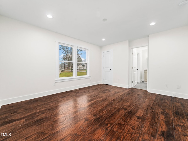 unfurnished room featuring hardwood / wood-style flooring