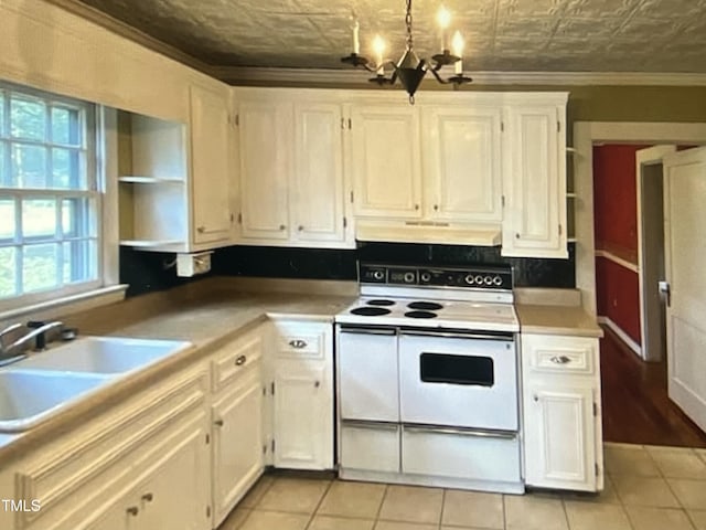 kitchen featuring sink, white cabinets, a chandelier, double oven range, and crown molding