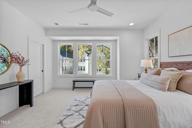 carpeted bedroom featuring ceiling fan