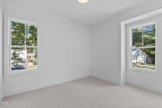 empty room featuring light carpet