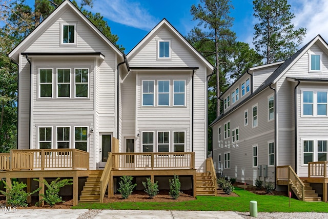 back of property with a wooden deck