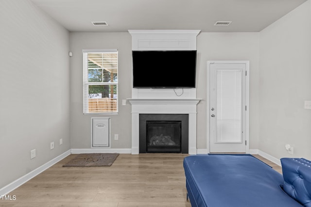 unfurnished living room with light wood-type flooring