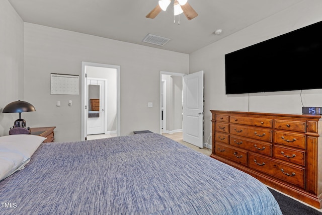 unfurnished bedroom featuring ensuite bathroom and ceiling fan