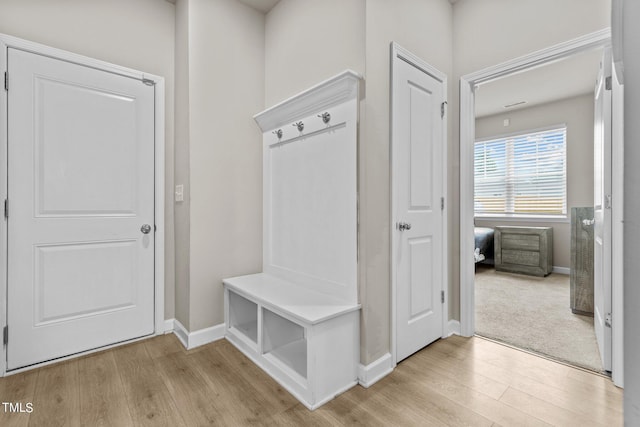 mudroom with light hardwood / wood-style flooring