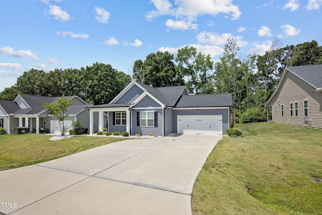 view of front of house featuring a garage and a front lawn