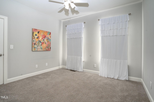 carpeted empty room with ceiling fan