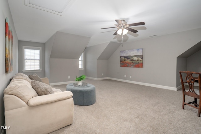 sitting room featuring light carpet and lofted ceiling