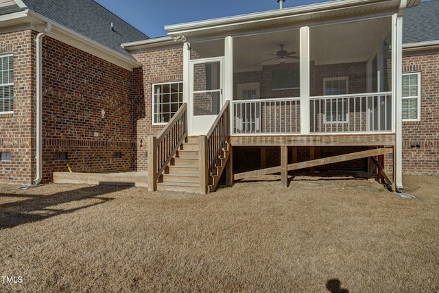 back of house with ceiling fan and a sunroom