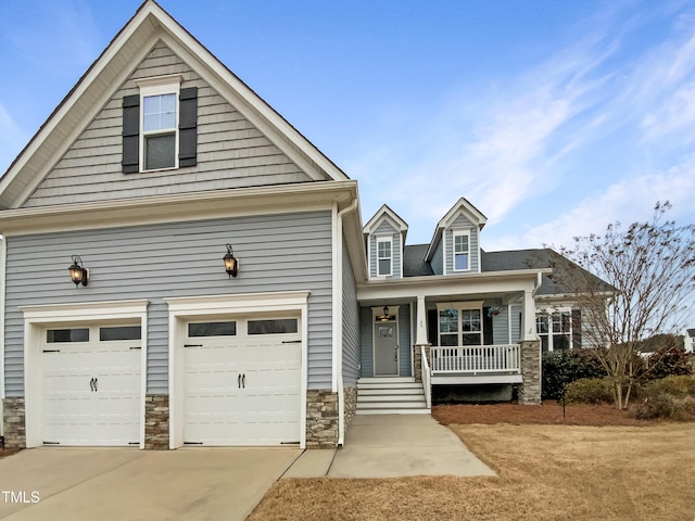 view of front of home with a porch and a garage