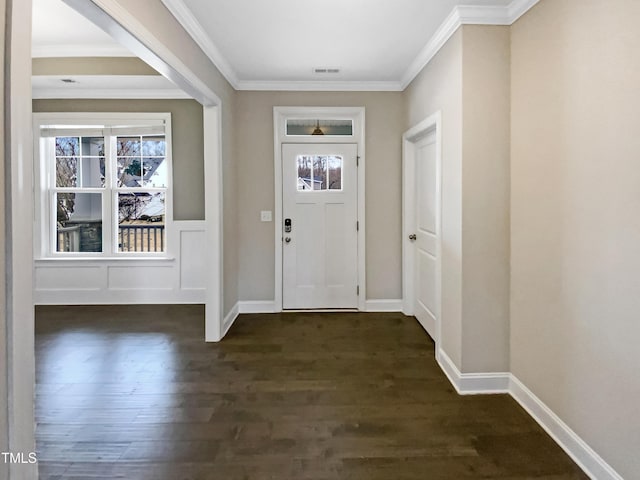 foyer entrance featuring dark hardwood / wood-style flooring and ornamental molding