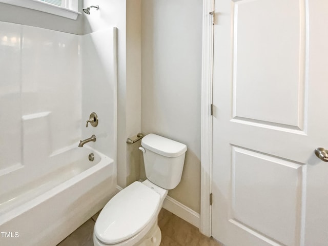 bathroom featuring toilet and shower / bath combination